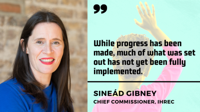 Sine&aacute;d Gibney, chief commissioner of the IHREC - woman with dark hair wearing a blue jumper - with quote - While progress has been made, much of what was set out has not yet been fully implemented.