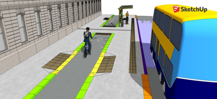 The design shows a bus pulling up to a bus shelter located between the road and cycle lane. This is similar to the previous design in this article, but a raised crossing point has been added beside the bus shelter. The crossing is made out of the same material - grey concrete - as the bus stop and path. There is tactile paving on either side of the crossing point. In the drawing, there is a cyclist approaching the crossing point and a pedestrian waiting for a bus.