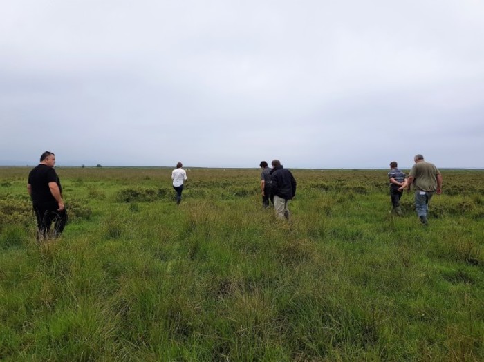 Kathryn Finney with farmers on training in the field for the breeding curlew project