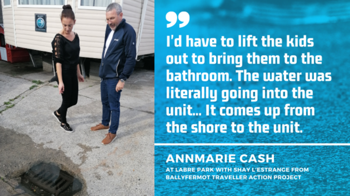 Annmarie Cash at Labre Park with Shay L'Estrange from Ballyfermot Traveller Action Project - they are both standing beside a flooded drain looking at it with a mobile home in the background. Cash said: I'd have to lift the kids out to bring them to the bathroom. The water was literally going into the unit... It comes up from the shore to the unit.