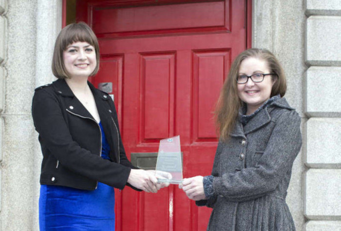 Photo of Michelle Hennessy and Maria Delaney collecting an award