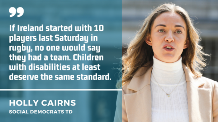 Holly Cairns wearing a white polo neck and beige coat speaking in front of the Dail with quote - If Ireland started with 10 players last Saturday in rugby, no one would say they had a team. Children with disabilities at least deserve the same standard.