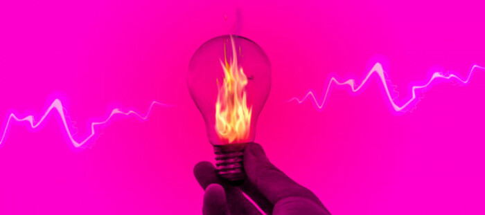 Design for LIGHTS OUT - A light bulb which is on fire being held in someone&rsquo;s hand with a jagged white line coming out of it symbolising electric current. 