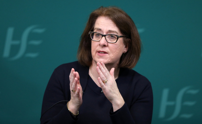 Anne O'Connor wearing a black top speaking at an event.