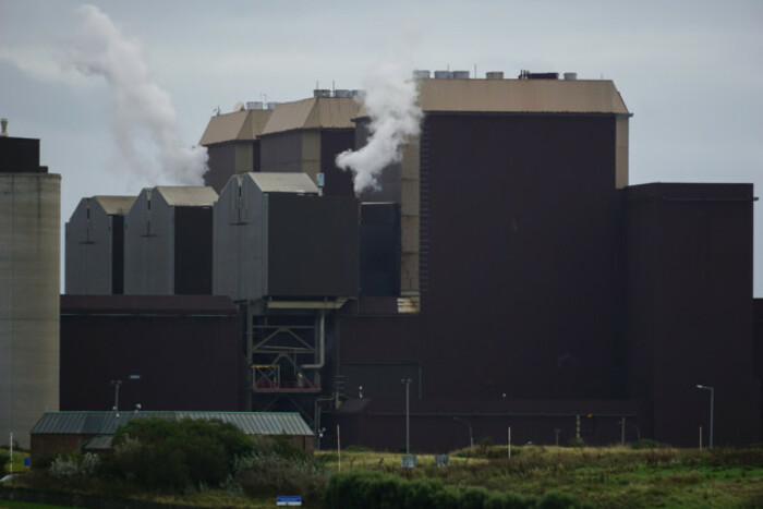 Power station building with smoke coming out of chimneys