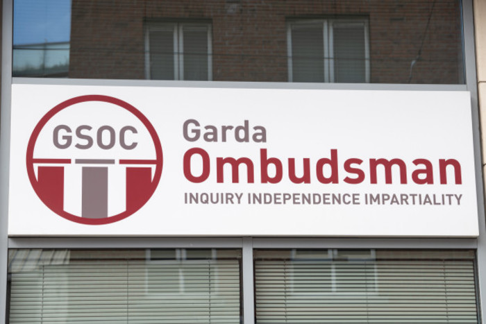 GSOC building: a white sign is affixed to a wall with windows above and below it. The sign has the GSOC logo and text which reads &ldquo;Garda Ombudsman: Inquiry Independence Impartiality&rdquo;