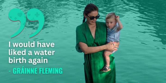 Gr&aacute;inne Fleming wearing a green dress holding her son beside a lake with quote - I would have liked a water birth again.